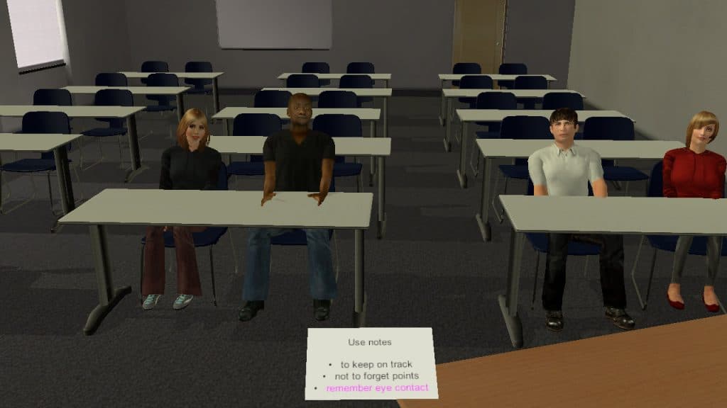 A presentation to a group of 4 attentive virtual people seated at tables in a classroom. Your notes are visible in front of you, helping to: keep you on track, not to forget points and remember eye contact.
