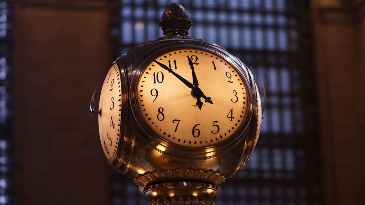 A station clock is at 7 before midnight on New Year's Eve. Time to make your resolution.