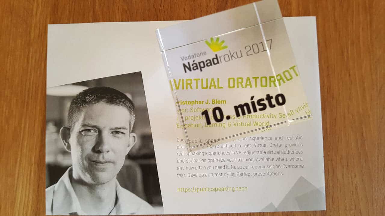 An image of a brochure page highlighting Virtual Orator's entry in the 'Idea of the Year' 2017 competition. The 10th place award, a see-through block, is seen on top if it.